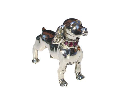 Lost wax carving of a dog cast in silver and set with ruby’s-Daniel Gallie