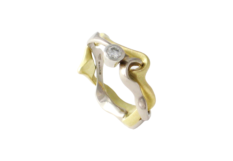 18Ct white and yellow gold Interlocking engagement ring set with diamond-Daniel Gallie